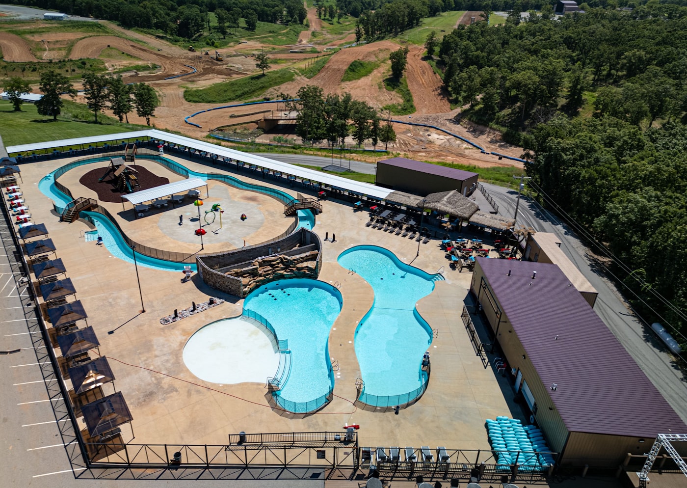 Aerial view of a water park lazy river and pools, similar in style to Adventure Island in Tampa